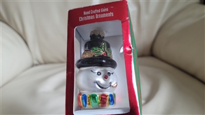Handcrafted vintage glass snowman Christmas ornament by Christmas House featuring painted details in original packaging