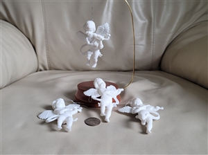 Snow white winged cherubs ornaments Hong Kong spiritual and holiday season decor