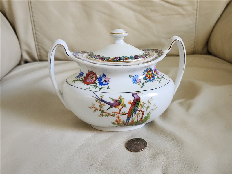 Phoenix China Czechoslovakia porcelain lidded sugar bowl featuring hand painted colorful birds floral garlands twin handles and gold trim from the 1930s