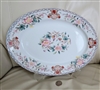 Antique Noritake Berkeley 1912 large oval porcelain serving platter on display stand showing hand painted floral centerpiece