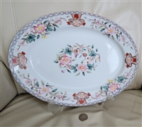 Antique Noritake Berkeley 1912 large oval porcelain serving platter on display stand showing hand painted floral centerpiece