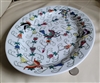 Hand-painted vintage 20th century Jingdezhen China large porcelain oval serving platter featuring multi-color Famille Rose butterfly and scrolling floral vine Chinoiserie artwork