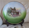 Large vintage German porcelain twelve inch decorative plate with colorful cottage and family scene