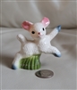 Vintage porcelain jumping happy lamb figure.