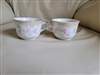 Pair of antique Doulton Burslem Bernice pattern Victorian porcelain teacups with pink floral theme and gold trim accents