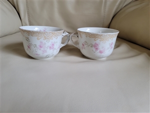 Pair of antique Doulton Burslem Bernice pattern Victorian porcelain teacups with pink floral theme and gold trim accents