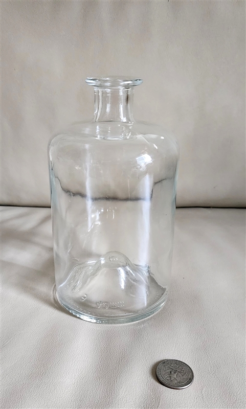 Saverglass France clear glass apothecary bottle with deep punt base on display
