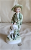Vintage Andrea by Sadek porcelain figurine of a young boy in blue overalls with a small brown dog made in Japan
