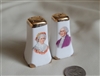 Vintage George and Martha Washington porcelain salt and pepper shakers with gold trim and portraits