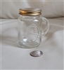 Pre-owned vintage Anchor Hocking glass shaker with gold metal lid and embossed T For Home Canning detail