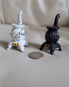 Salt and pepper metal shaker pot belly stove shape in black and white design preowned gentle color wear