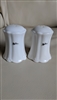 set of two white ribbed porcelain salt and pepper shakers with oleg cassini branding