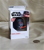 New old stock box displaying a black 2019 Star Wars Darth Vader helmet mini bluetooth speaker next to a coin for size reference