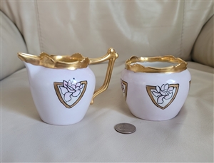 Theodore Haviland Limoges antique French porcelain creamer and open sugar bowl set with lotus medallions and gold trim from the 1900s
