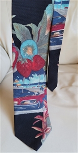 Pre-owned vintage Robert Stock 100% silk tie with a colorful beach scene featuring a classic car, bicycle, and palm trees.