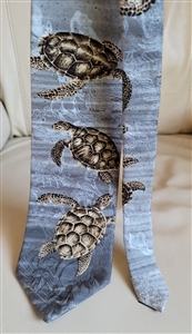 Pre-owned vintage Endangered Species 100% silk tie with a detailed green sea turtle wildlife illustration.