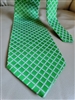 Pre-owned vintage Giorgio Armani 100% silk tie featuring a vivid green and white geometric grid pattern, handmade in Italy.