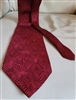 Pre-owned vintage NEO Bill Blass 100% silk tie featuring an elegant burgundy red tonal geometric pattern.