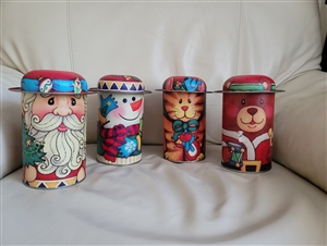 Vintage tin storage 4 lidded boxes holiday decor colorful santa bear cat and dog Christmas storage