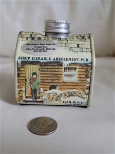 Vintage log cabin tin box with New Hampshire maple syrup design showing preowned condition