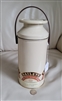Preowned vintage 1992 Baileys Irish Cream milk can shaped tin storage box container with a swinging plastic handle top off view