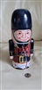 Scottish piper 9 inch tall tin storage box display shown with reference coin