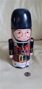 Scottish piper 9 inch tall tin storage box display shown with reference coin