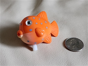 Orange spotted plastic windup fish gift or toy