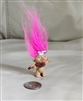 Vintage miniature chef troll doll with pink hair holding a spoon showing paint wear