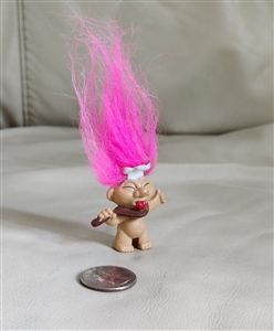 Vintage miniature chef troll doll with pink hair holding a spoon showing paint wear