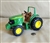 Vintage ERTL John Deere steerable tractor toy with metal frame and plastic undercarriage