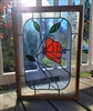 Handcrafted stained glass picture frame featuring a red rose design with decorative leaded glass borders 1980s