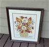 Vintage handmade crewel embroidery floral bouquet in dark wooden frame with glass