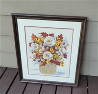 Vintage handmade crewel embroidery floral bouquet in dark wooden frame with glass