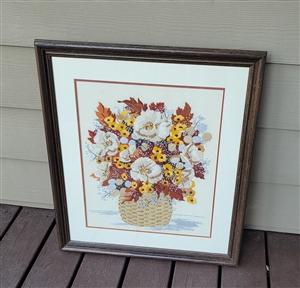 Vintage handmade crewel embroidery floral bouquet in dark wooden frame with glass