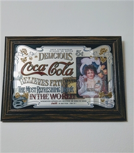 Vintage 1975 Coca-Cola advertising mirror featuring Hilda Clark decoupage in a wooden frame