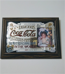 Vintage 1975 Coca-Cola advertising mirror featuring Hilda Clark decoupage in a wooden frame