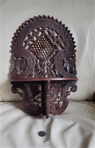 Intricately carved 1970s vintage Indian wooden folding wall shelf with floral pattern