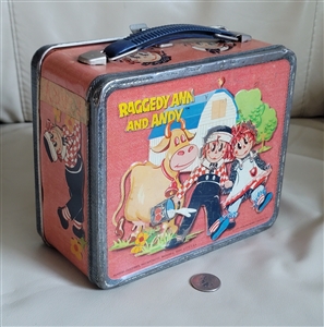 Vintage 1973 Aladdin Industries embossed metal lunch box featuring Raggedy Ann and Andy