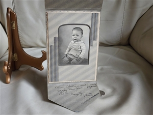 Vintage baby picture in a cardboard envelope frame black white and gray design collectible display