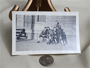Antique pale black and white photograph of a group of WWI US Army soldiers in uniform