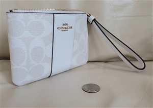 New old stock Coach signature coated canvas wristlet with retail tags and white leather trim