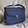 Vintage Guy Laroche Paris navy blue shoulder bag featuring an authentic logo fabric body with genuine leather trim and a gold tone logo emblem