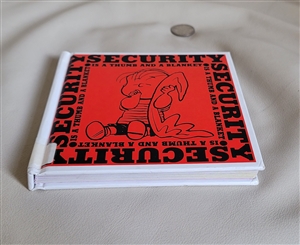 Vintage Peanuts book titled Security Is a Thumb and a Blanket published in two thousand and six in very nice condition