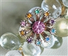 Vintage multicolor rhinestone starburst floral brooch front and back view
