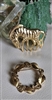 Vintage 1980s gold tone zebra and floral wreath brooch set showing textured animal pin and leaf circle brooch front and back views