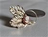 Vintage gold filled cameo brooch with textured looped leaves and oval female silhouette portrait front and back views