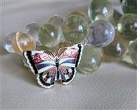 Vintage 1970s Gold Tone Butterfly Brooch with Red Blue and Yellow Enamel Application