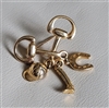 Vintage 1980s gold tone equestrian snaffle bit brooch with dangling horse charms