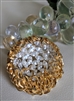Vintage 1960s gold tone sunburst brooch with clear marquise glass stones